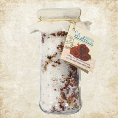 Safaga red sea salt with rose petals in a glass jar.
