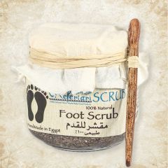 Foot exfoliating scrub cream in a glass jar.
