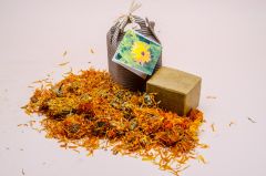 Castile Soap with calendula flowers packed in a carton box. 

